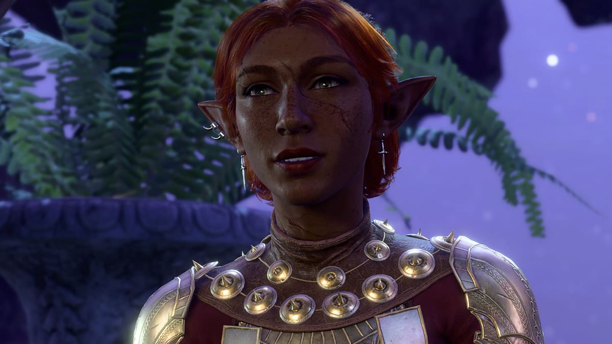 BG3 screenshot of a female elf guardian with red hair and gold armor.