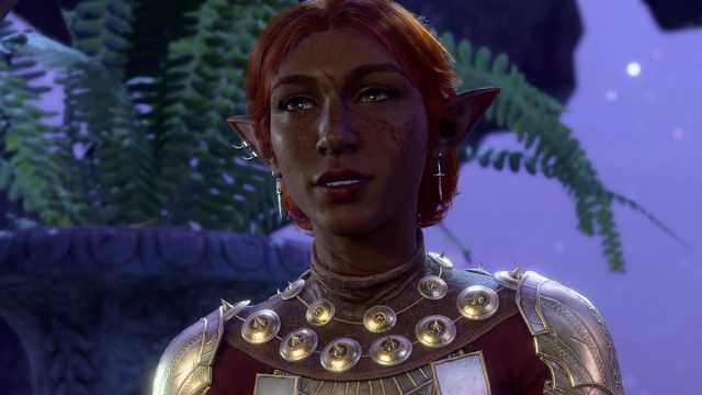 BG3 screenshot of a female elf guardian with red hair and gold armor.