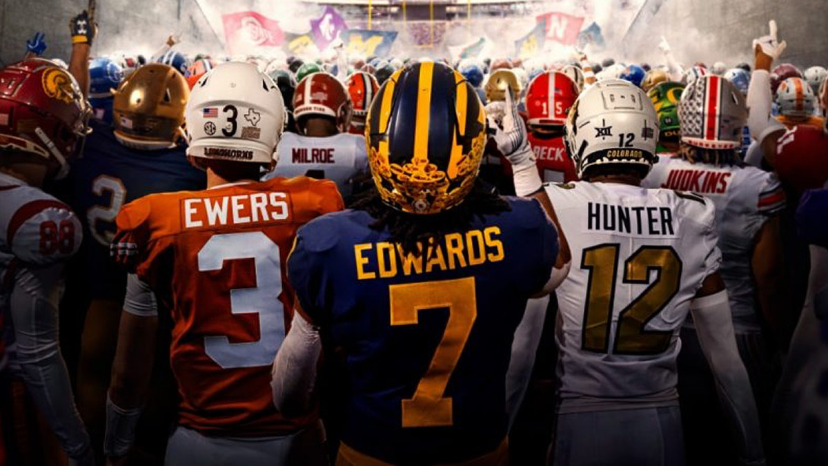 An image of many college football players facing away from the camera, walking onto the field.