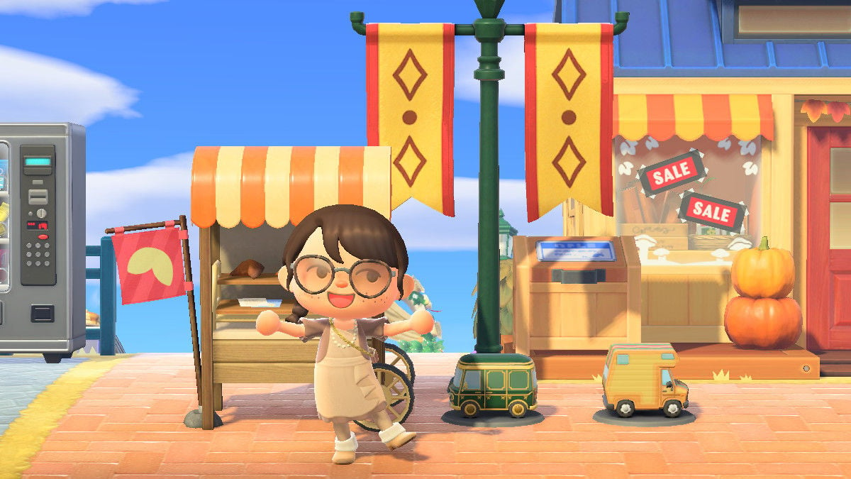 An Animal Crossing: New Horizons screenshot of the player in front of various Pocket Camp collaboration items.